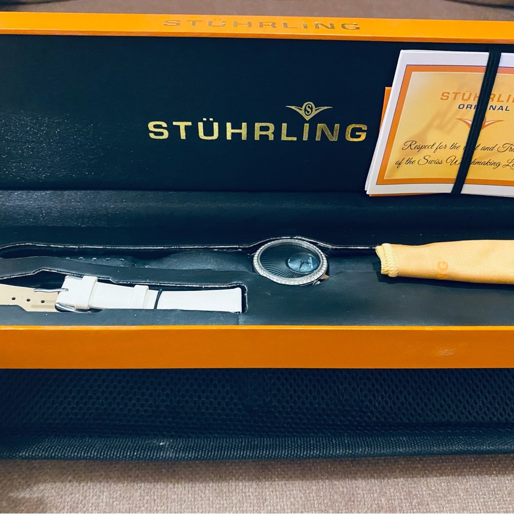 Multi band Stuhrling watch. EUC 2 bands. Black and white